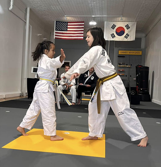 Two young students practicing in class