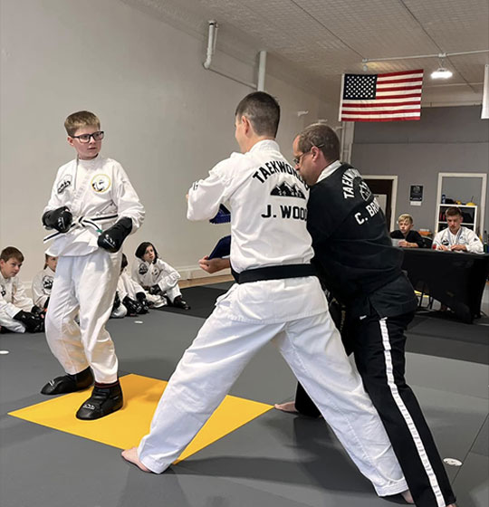 Instructor leading a teen and adult drill